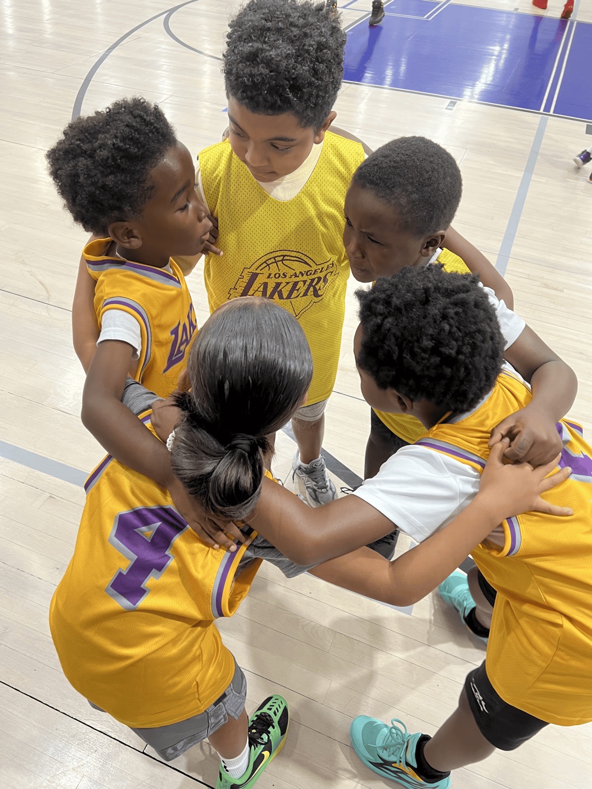 Young players huddling together during a game