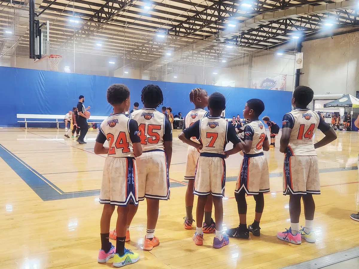 Crunchtime players watching from the sideline during a tournament game