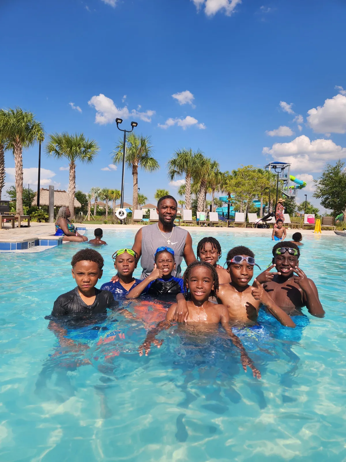 Crunchtime players and their coach cooling off together on a tournament trip